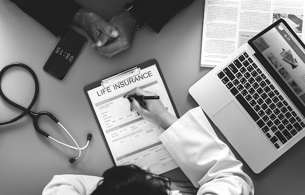 People sitting at a desk and filling out paperwork