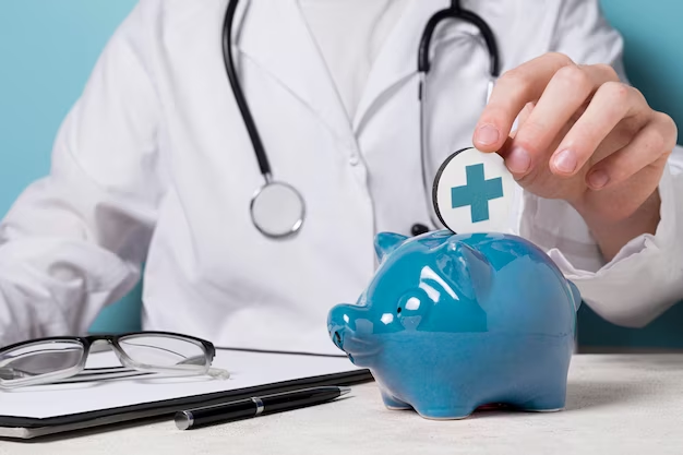 A doctor sits at a desk next to a piggy bank