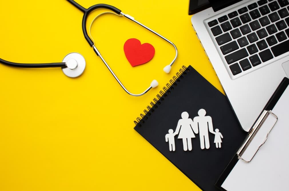 Medical supplies with a family cutout on a bright yellow background.