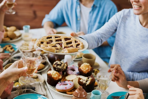 Family gathering around a table, enjoying a homemade meal.