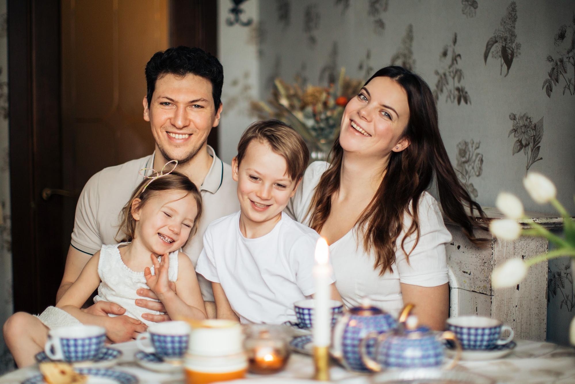 Blended Family – mother, fathers and children in the kitchen.